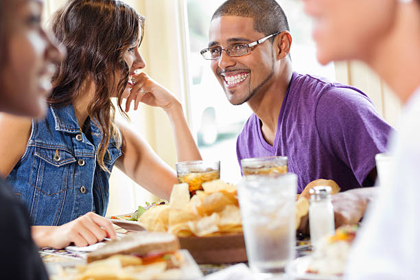 istock Multi-Ethnic Friends Eating Lunch At Restaurant. 174787813
