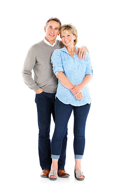 Full length portrait of happy mature couple together on white background
