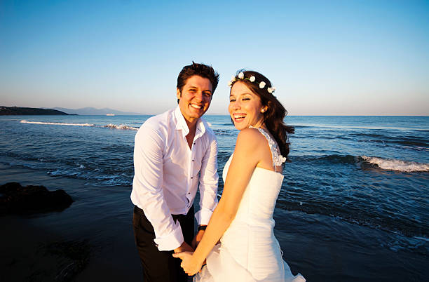istock Happy newlywed couple on the beach 174788079