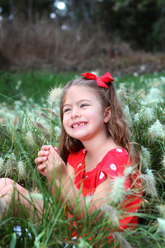 happy girl in the tall grass