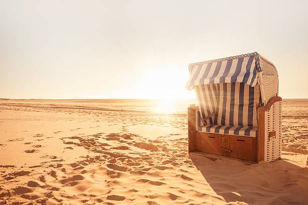 Beach chair Beach chair in the sun hooded beach chair stock pictures, royalty-free photos & images