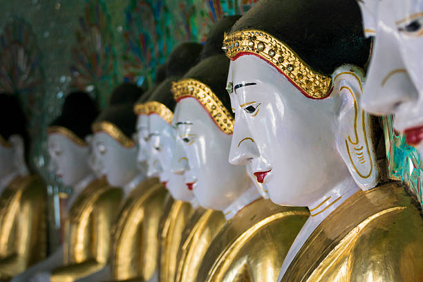 istock Buddha statues in a row, the Umin Thounzeh temple 174788365