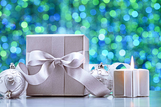 istock Silver christmas decoration on turquoise colored illuminated background 174788505