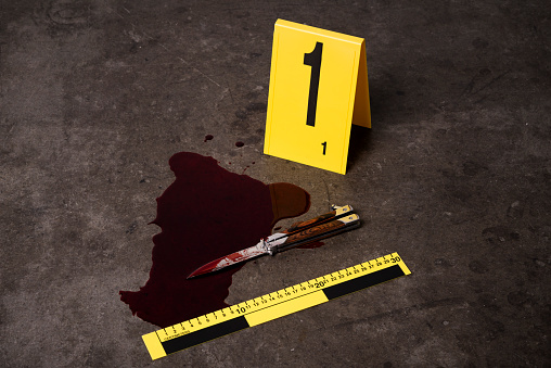 Knife in blood and evidence marker