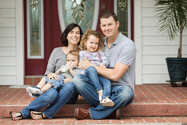 istock Happy Two Generation Family Sitting Outside House 174788753