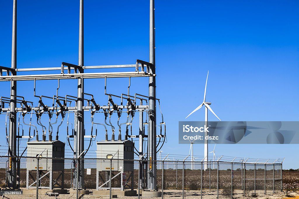 power collection grid substation and wind turbine Wind Turbines and electricity power collection grid substation Electrical Grid Stock Photo