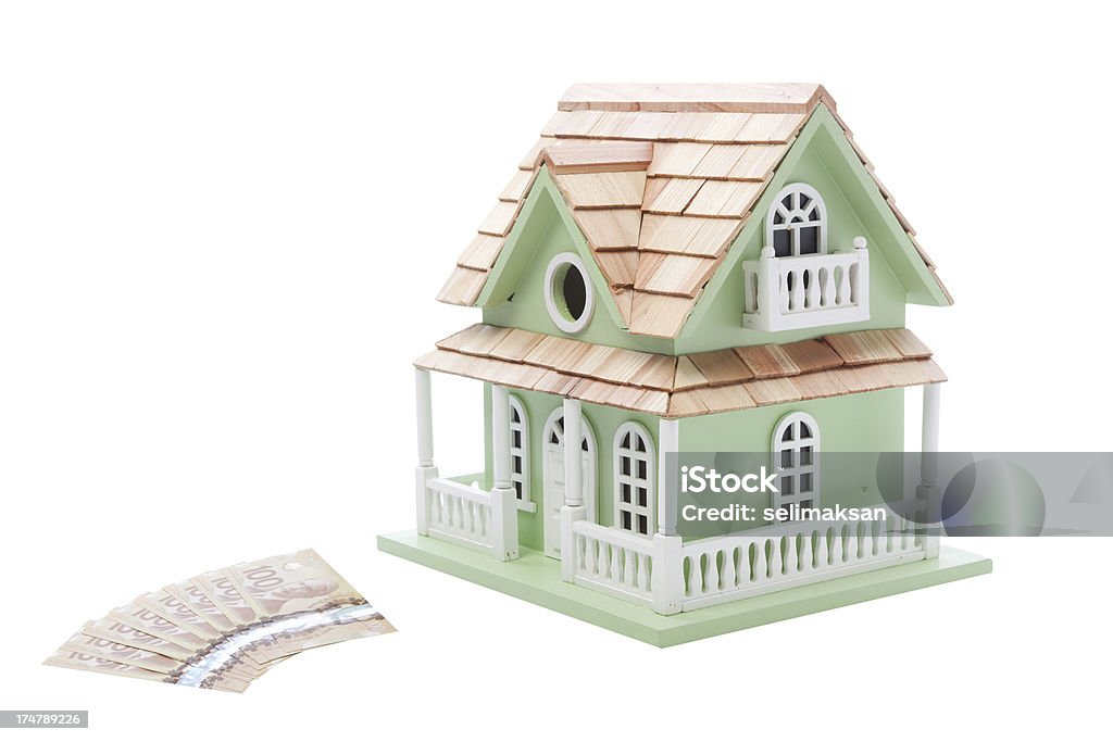 Billet de dollar canadien et le modèle de maison pour l'immobilier concept - Photo de Acheter libre de droits