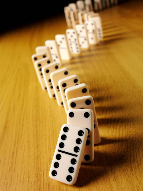 istock Dominoes on a Wooden Background 174789704