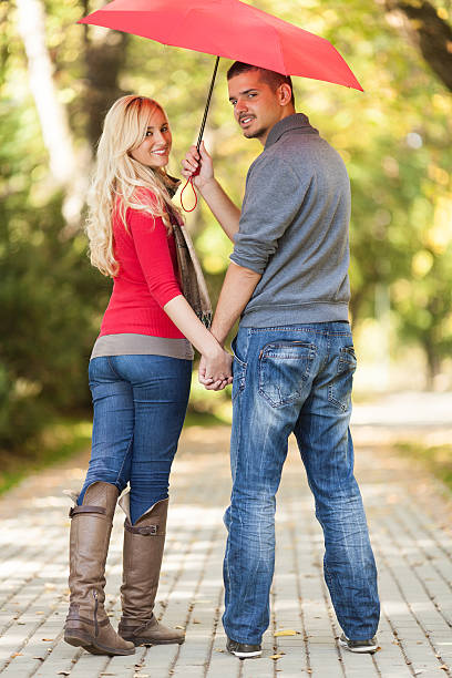 istock Young couple walking in a park 174789965