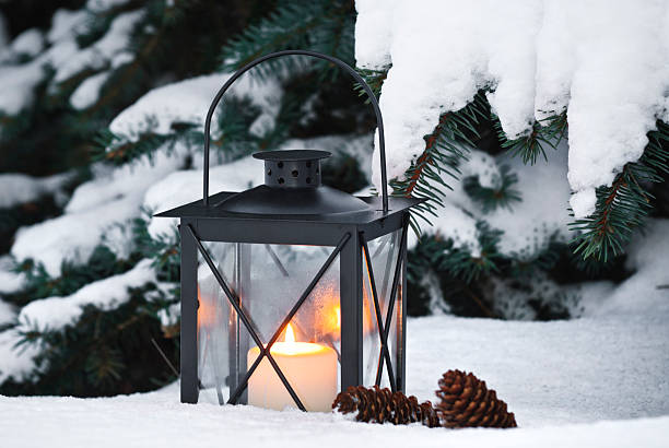 istock Lantern with candle in the snow 174790248