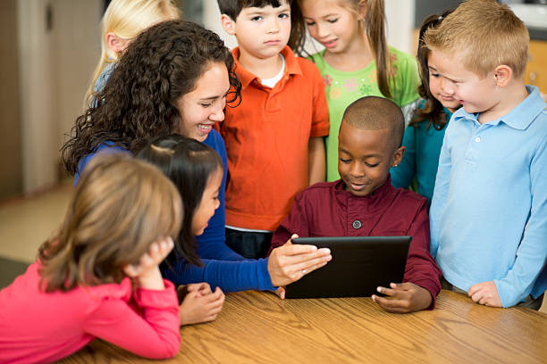 istock teacher and preschool Class looking at tablet 174790280