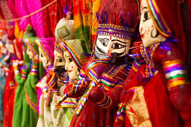 Colorful Rajasthani puppets "Traditional colorful puppet dolls sold in the streets of Jodhpur in Rajasthan, India. The puppets are typical in the Rajasthan region and are used for entertainment purposes.The puppets have a wooden head and their clothing is made of brightly colored pieces of rags." india indian culture market clothing stock pictures, royalty-free photos & images