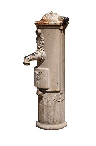 The French drinking fountain isolated on the white background