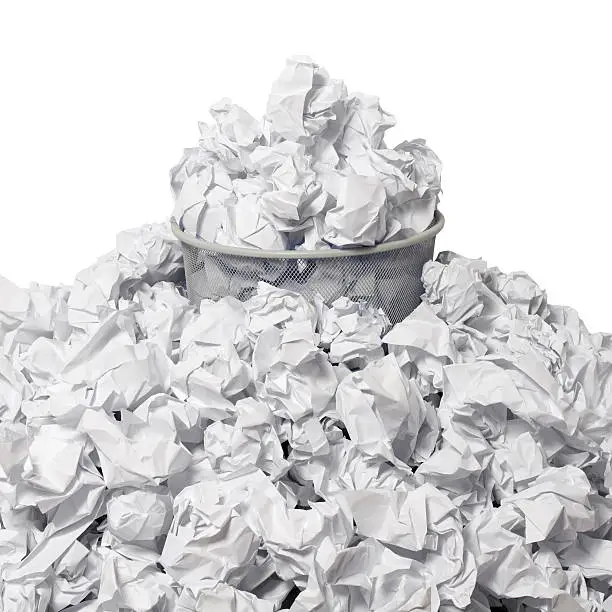 "Full wastepaper basket surrounded by crumpled paper, isolated on white.Related images:"