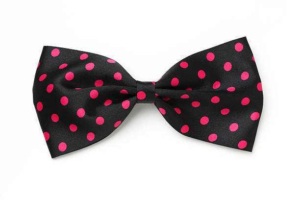 istock A black bow tie with hot pink polka dots  174791671