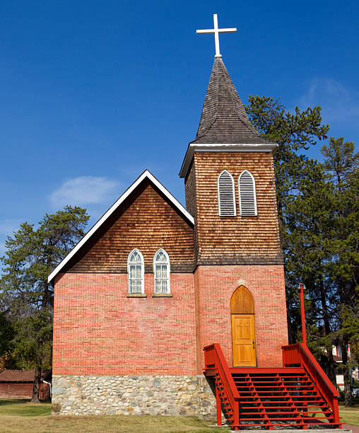 alte roman catholic church-jasper, alberta - steeple outdoors vertical alberta stock-fotos und bilder