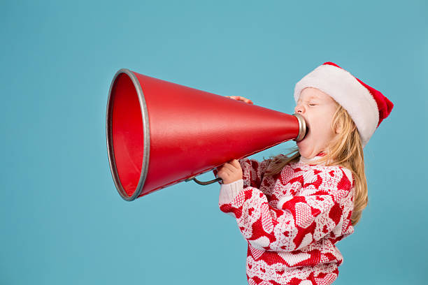 istock Santa's Little Helper Making Announcement With Megaphone 174792712