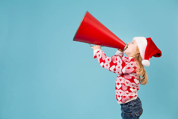 istock Santa's Little Helper Making Announcement With Megaphone 174792715