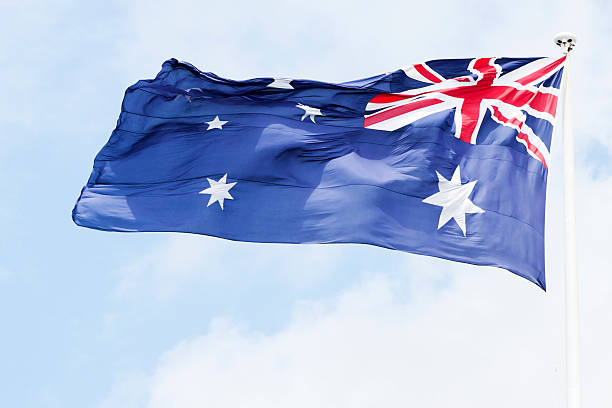 istock Australian flag in the wind against sky, copy space 174793345