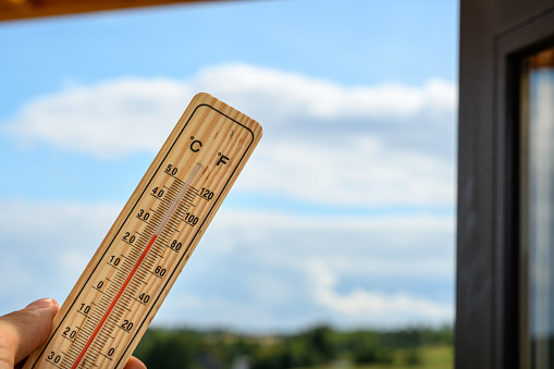 Wooden internal thermometer shows high temperature