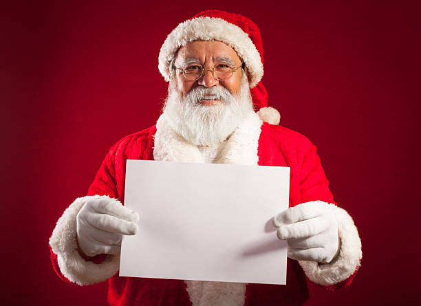 istock Traditional Santa Claus showing an empty paper 174793770