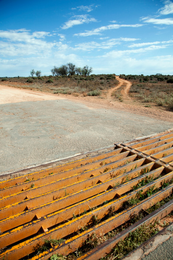 Cattle grid on a dirt road in outback Australia