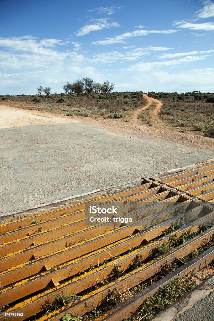 Cattle grid in outback Australia Cattle grid on a dirt road in outback Australia Agriculture Stock Photo