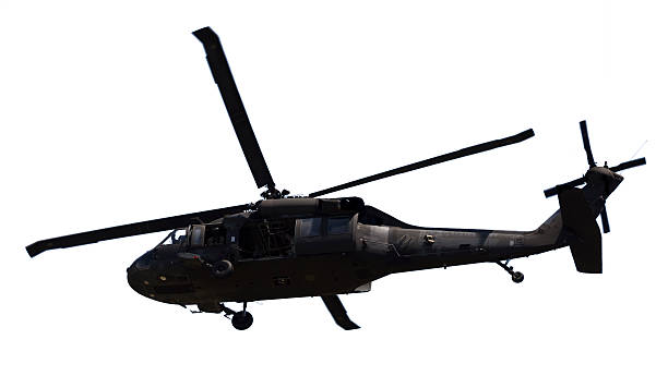 istock US Army Helicopter Silhouette Turning on Isolated White Background 174794286