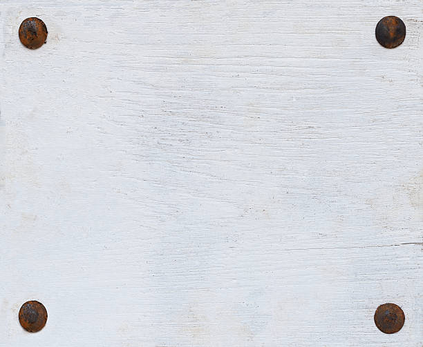 istock White grunge wood board with four bolts. 174794301