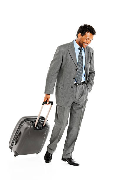 istock Happy businessman on business trip smiling 174794798