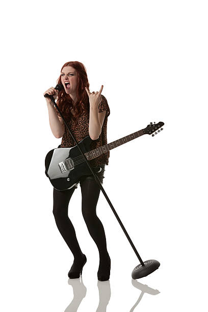 istock Female musician singing into a microphone 174794903