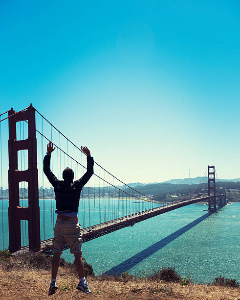 istock Man jumping against the San Francisco golden gate bridge 174794925