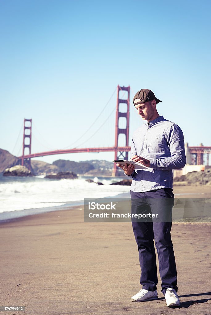 Social media chatting under San Francisco golden gate  20-24 Years Stock Photo