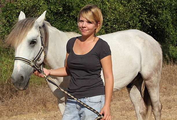 istock woman with horse 174795217
