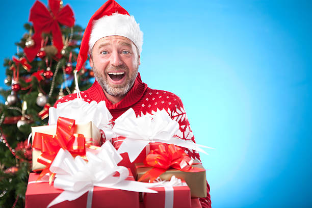 istock Mature man by christmas tree. 174795566