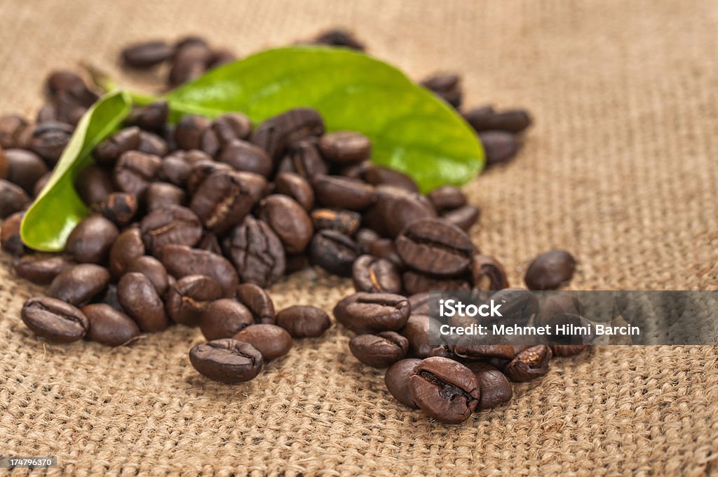 Close up coffee beans with leaves Coffee beans on burlap Leaf Stock Photo