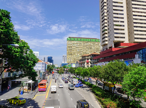 Singapore - Jun 13, 2017. Cars run on street at Chinatown in Singapore. Since independence in 1965, the Singapore economy has experienced rapid economic development.