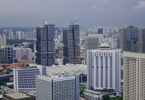 Singapore - Jun 13, 2017. Aerial view of business center at misty day in Singapore. Singapore is the third-largest financial centre, and the second-busiest container port.