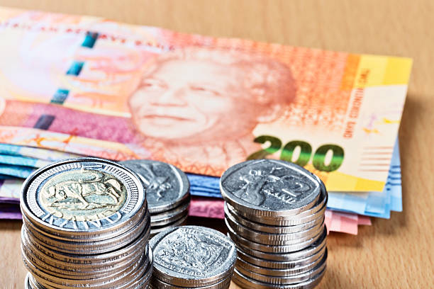 istock Silver South African coins with new Mandela banknotes 174796711