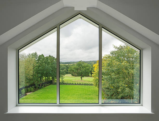 beautiful penthouse window a beautiful window from a luxury penthouse apartment with a view over a garden with golf course and countryside in the background. Looking for a window Please see my window collection including cut-outs with clipping paths by clicking on the Lightbox Link below... pentagon windows stock pictures, royalty-free photos & images