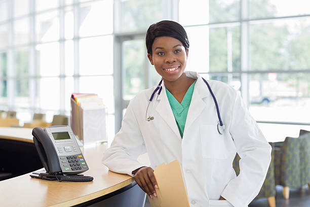 istock Doctor with stethoscope at a medical center front desk 174797536