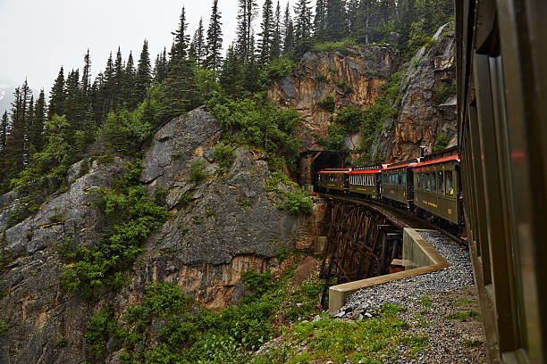 White Pass Railway Train Winds Into Tunnel stock photo