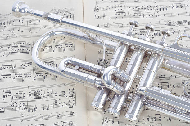 istock silver trumpet and old sheet music 174797732