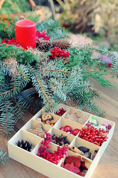 istock creating advent wreath with candle and ornaments 174797966
