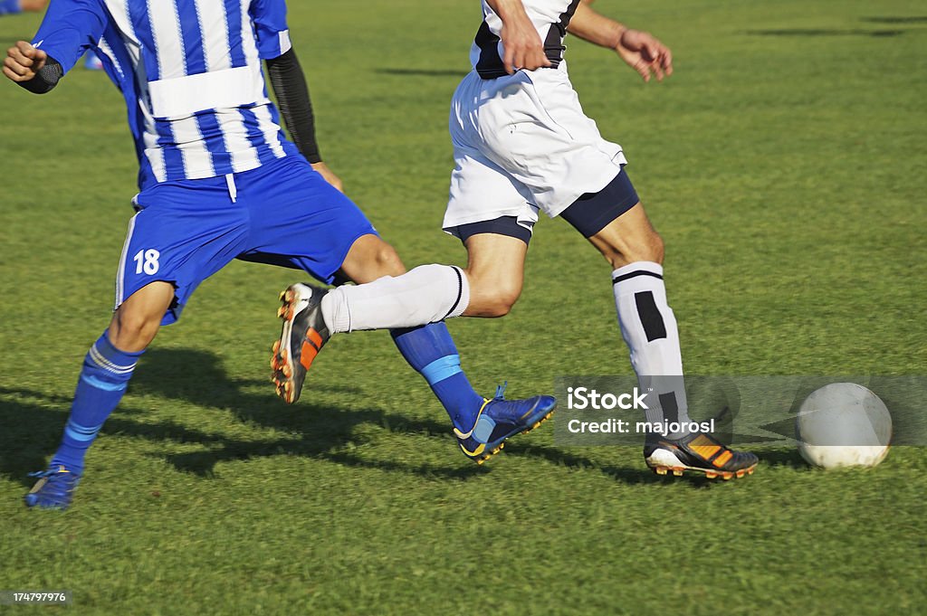 Soccer players en acción - Foto de stock de Adulto libre de derechos