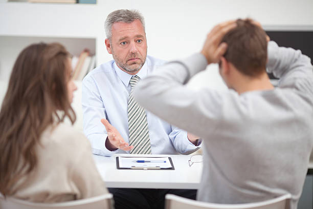 istock Couple with consultant. 174798237