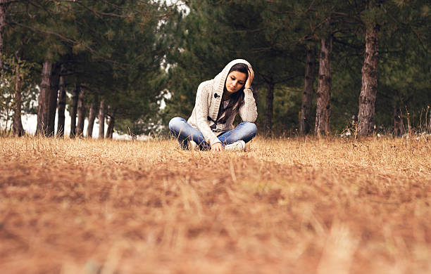 istock Sad girl in autumn park 174798367