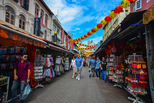 Singapore - Jun 12, 2017. People on street of Chinatown district in Singapore. Singapore Chinatown is a world famous bargain shopping destination.