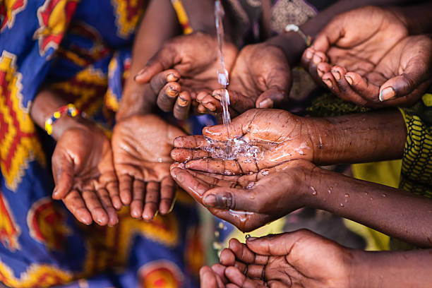 istock Hands of poor - asking for drinking water, Africa 174798915