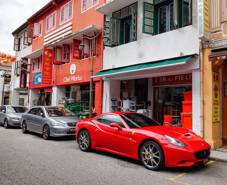 Singapore - Dec 14, 2015. Cars parking on an old street in Chinatown, Singapore. Chinatown has had a historically concentrated ethnic Chinese population.